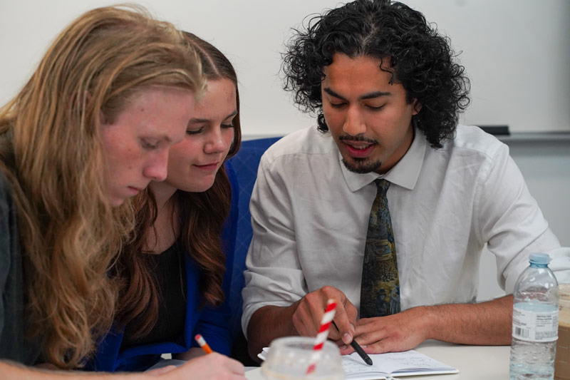 Ethics bowl teams present on ethical issues and refine their viewpoints in response to feedback. The USask team of Blake Kemmer, Hayley Allen and Hamza Saghir also participated in the College Ethics Bowl.
