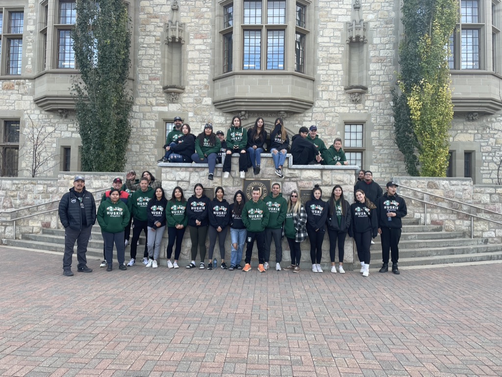 Students and staff members from Montreal Lake Cree Nation and Little Red Cree Nation in front of the Peter McKinnon building at the University of Saskatchewan campus